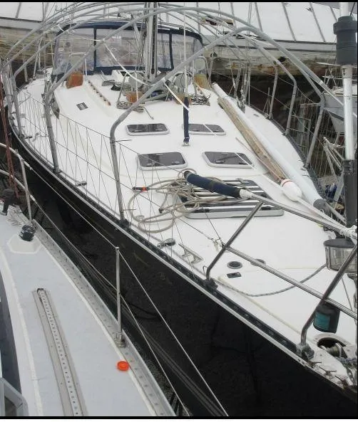 Slide: The Image of Sailboat C&C 51 XL C/B 1994 docked, featuring sleek design and spacious deck. - 32