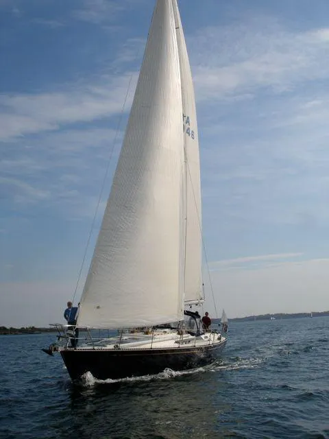 Slide: The Image of Sailing yacht C&C 51 XL C/B 1994 on open water under clear skies. - 35