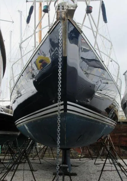 Slide: The Image of Sailboat C&C 51 XL C/B 1994 on dry dock, front view with anchor chain. - 38