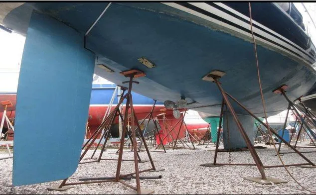 Slide: The Image of Sailboat C&C 51 XL C/B 1994 on stands in a boatyard. - 39