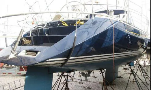 Slide: The Image of C&C 51 XL C/B 1994 sailboat on stands, blue hull, rear view. - 40