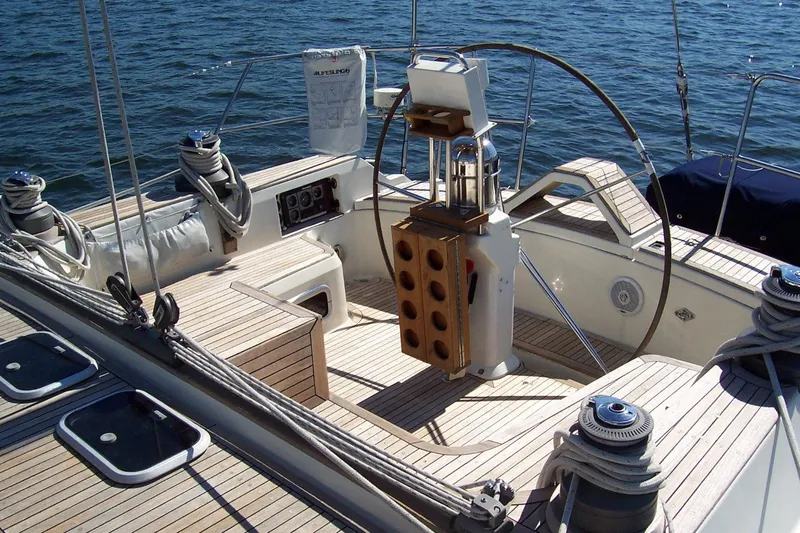 Slide: The Image of Cockpit of 1994 C&C 51 XL C/B sailboat with wooden deck and steering wheel. - 9