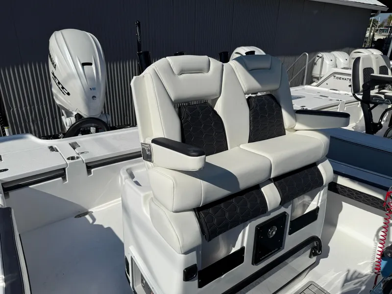 Slide: The Image of 2025 Tidewater 2700 Carolina Bay boat with dual cushioned seats and modern design. - 4