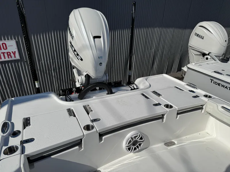 Slide: The Image of 2025 Tidewater 2700 Carolina Bay boat with Yamaha engines, featuring spacious deck and storage compartments. - 5