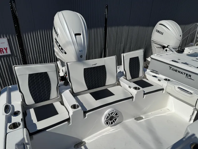 Slide: The Image of 2025 Tidewater 2700 Carolina Bay boat with Yamaha engines and stylish seating. - 6