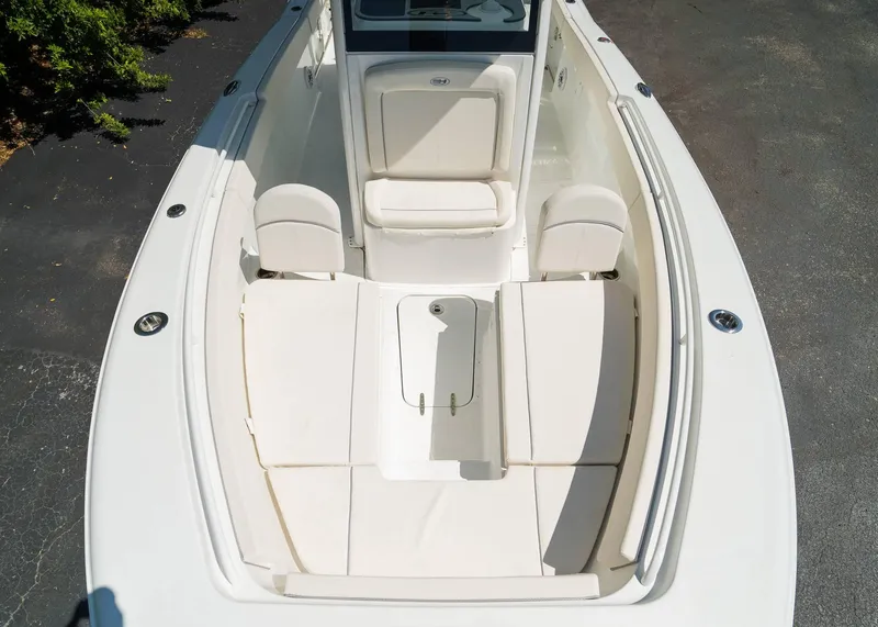 Slide: The Image of 2025 Sea Hunt Gamefish 25 boat interior with cushioned seating and storage compartments. - 20