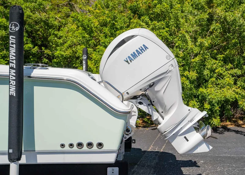 Slide: The Image of 2025 Sea Hunt Gamefish 25 with Yamaha outboard motor, parked outdoors. - 4