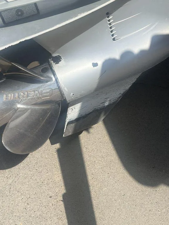 Slide: The Image of Close-up of a 2003 Grady-White 306 Bimini boat propeller and lower unit. - 12