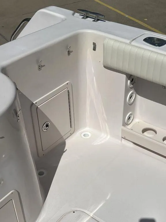 Slide: The Image of 2003 Grady-White 306 Bimini boat interior, featuring storage compartments and seating area. - 20