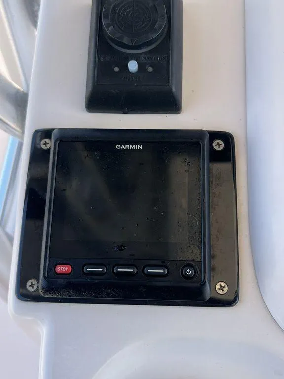 Slide: The Image of Garmin marine device on 2003 Grady-White 306 Bimini boat dashboard. - 25