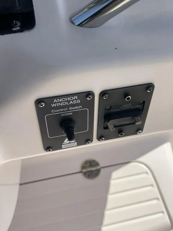 Slide: The Image of Control panel of a 2003 Grady-White 306 Bimini boat, featuring anchor windlass switch. - 26