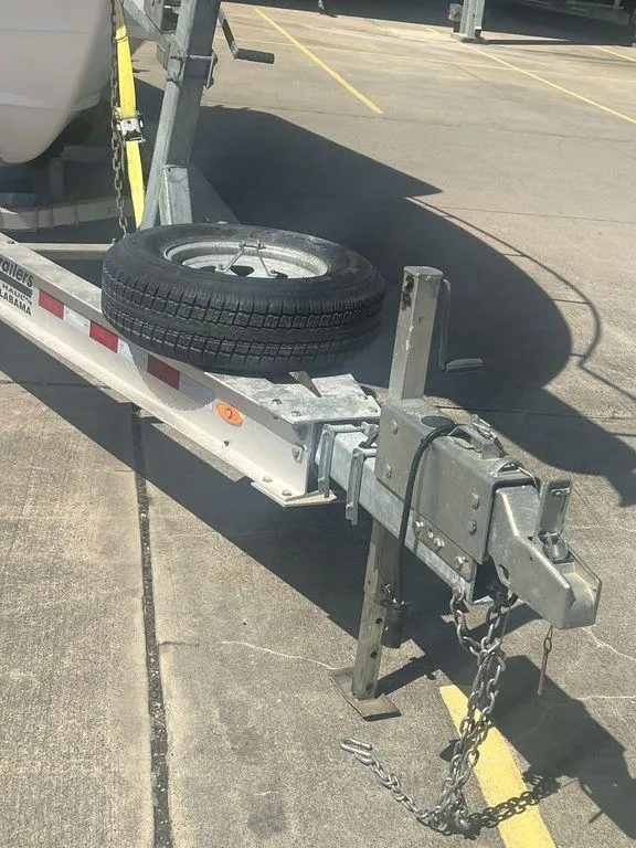 Slide: The Image of Trailer hitch and spare tire for 2003 Grady-White 306 Bimini boat. - 3