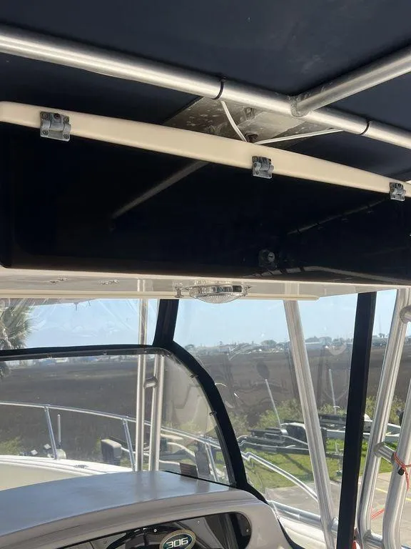 Slide: The Image of 2003 Grady-White 306 Bimini boat interior with dashboard and canopy view. - 31