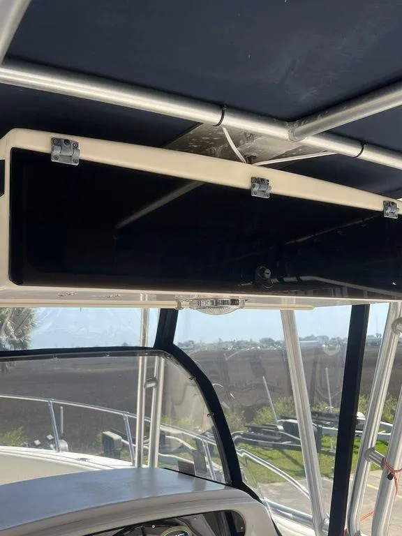 Slide: The Image of 2003 Grady-White 306 Bimini boat interior with overhead storage compartment. - 32