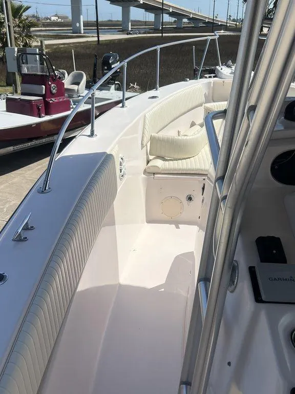 Slide: The Image of 2003 Grady-White 306 Bimini boat interior with cushioned seating and railing. - 33