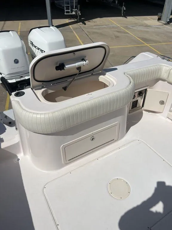 Slide: The Image of 2003 Grady-White 306 Bimini boat interior with open storage compartment. - 34