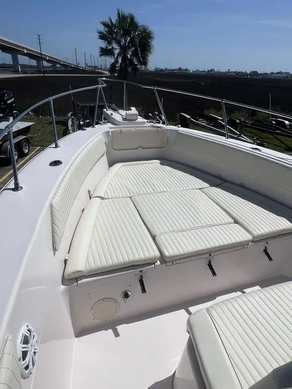 Slide: The Image of 2003 Grady-White 306 Bimini boat with spacious seating and sleek design. - 38