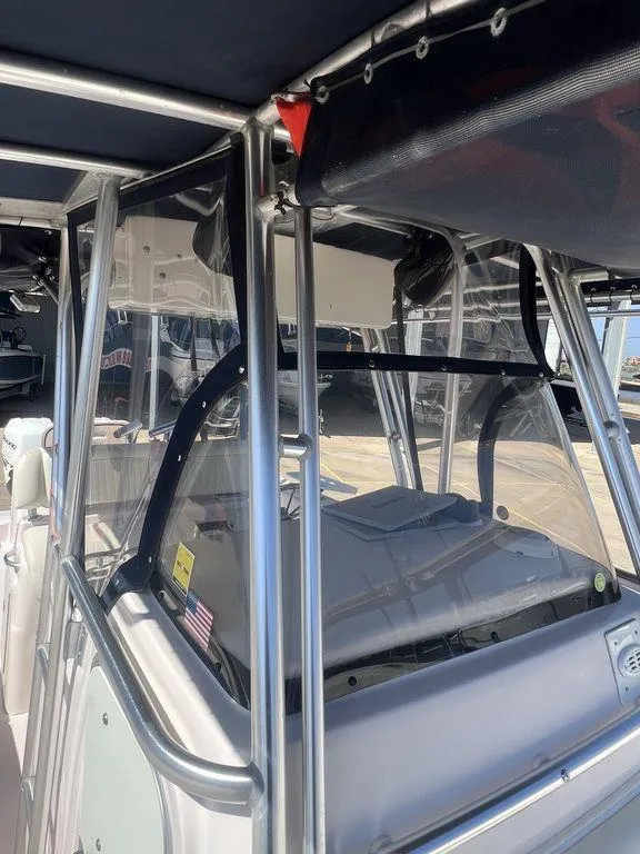 Slide: The Image of 2003 Grady-White 306 Bimini boat with stainless steel frame and clear enclosure. - 40