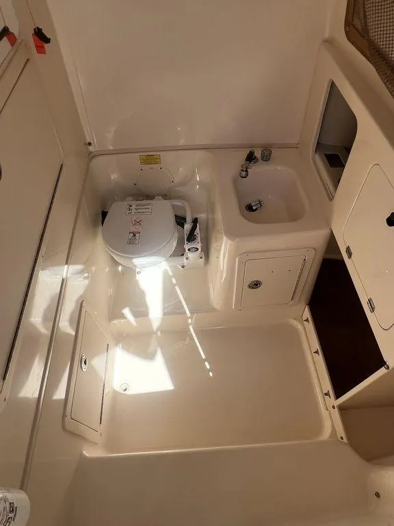 Slide: The Image of 2003 Grady-White 306 Bimini boat interior with sink and toilet. - 41