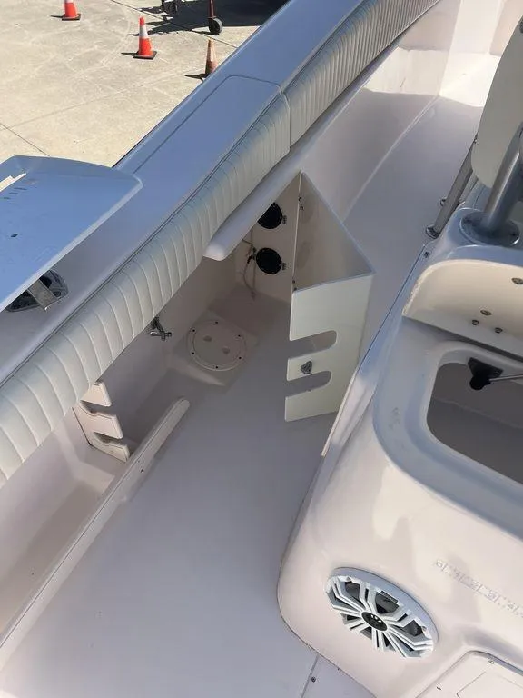 Slide: The Image of 2003 Grady-White 306 Bimini boat interior with seating and storage compartments. - 47