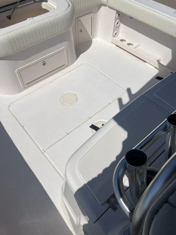 Slide: The Image of 2003 Grady-White 306 Bimini boat deck with seating and storage compartments. - 49