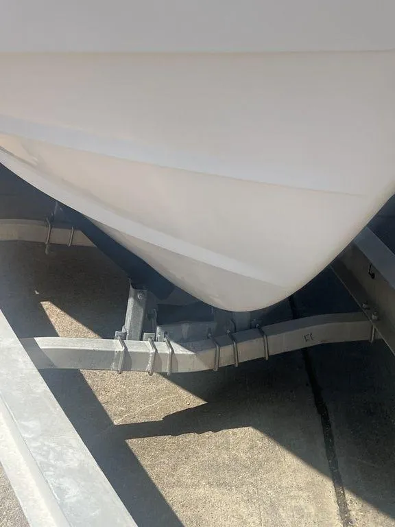 Slide: The Image of 2003 Grady-White 306 Bimini boat hull on trailer, close-up view. - 6