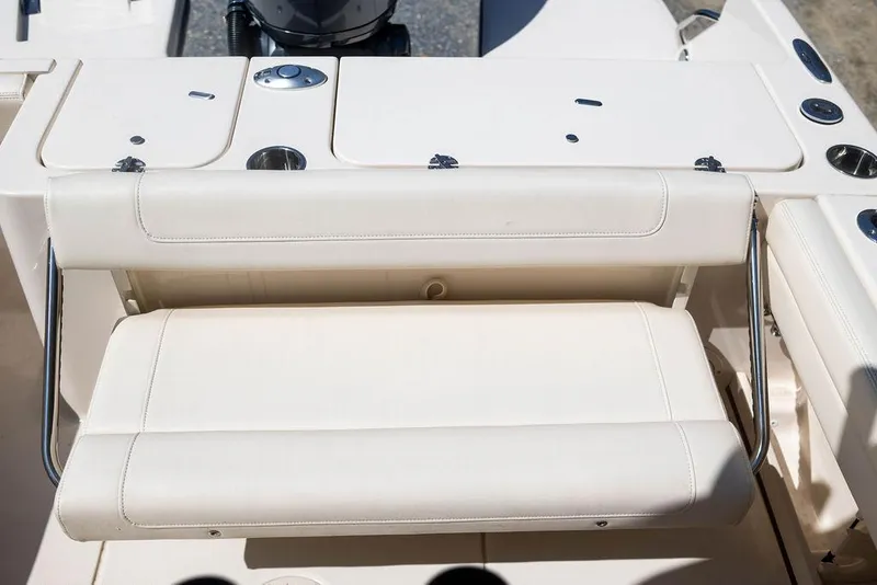Slide: The Image of 2023 Grady-White Fisherman 236 boat seating area with storage compartments. - 13