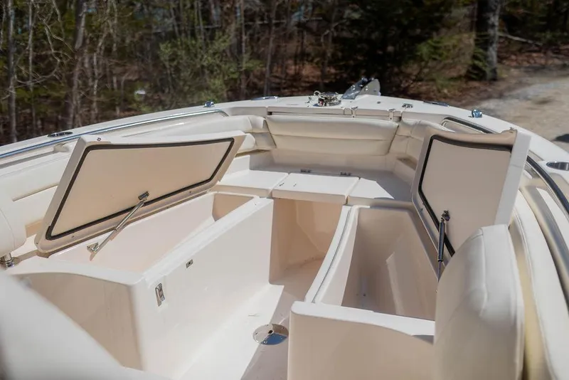 Slide: The Image of 2023 Grady-White Fisherman 236 boat with open storage compartments. - 17