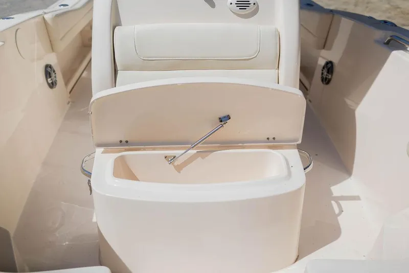 Slide: The Image of 2023 Grady-White Fisherman 236 boat interior with open storage compartment. - 18