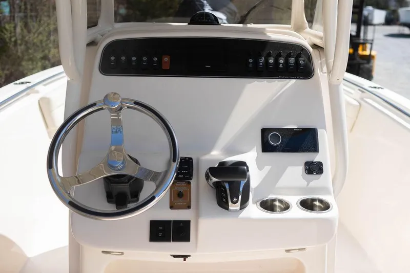 Slide: The Image of 2023 Grady-White Fisherman 236 boat console with steering wheel and controls. - 6