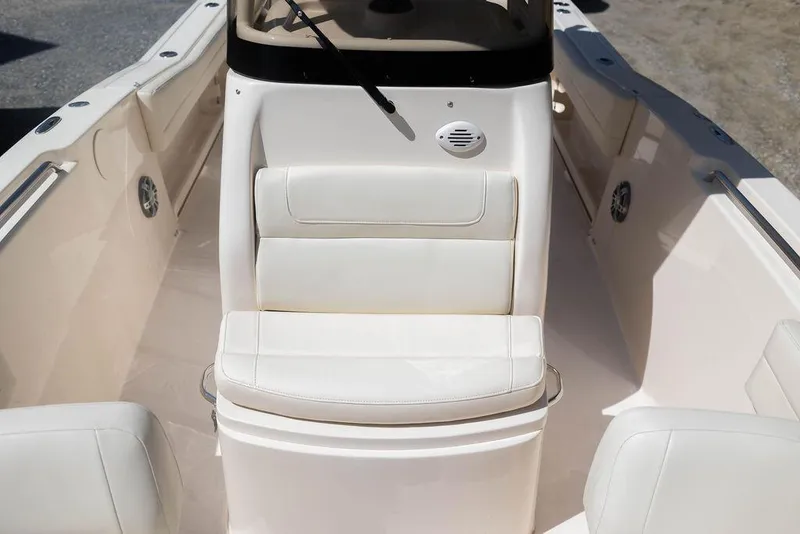 Slide: The Image of 2023 Grady-White Fisherman 236 boat interior with white seating and console. - 8