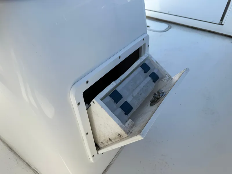 Slide: The Image of Open storage compartment on 2020 Cape Horn 27 XS boat deck. - 29