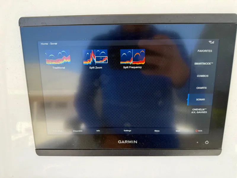 Slide: The Image of Garmin sonar display on 2020 Cape Horn 27 XS boat, showing traditional, split zoom, and frequency options. - 36