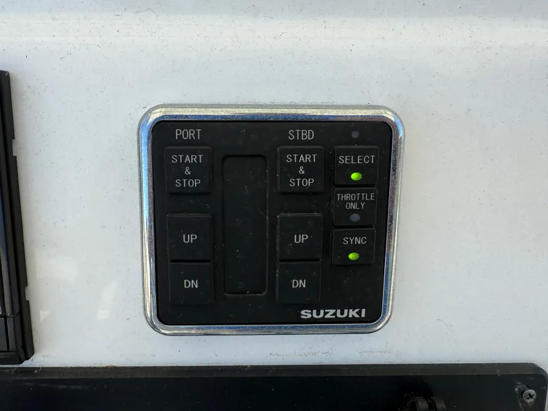 Slide: The Image of Control panel of a 2020 Cape Horn 27 XS boat with Suzuki engine controls. - 45