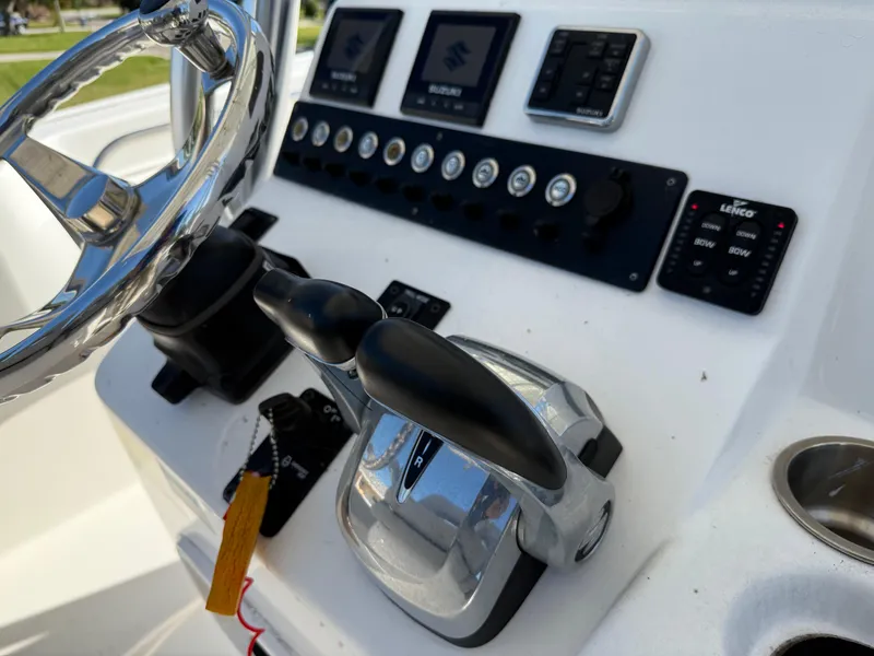 Slide: The Image of Boat control panel of 2020 Cape Horn 27 XS with steering wheel and throttle levers. - 46