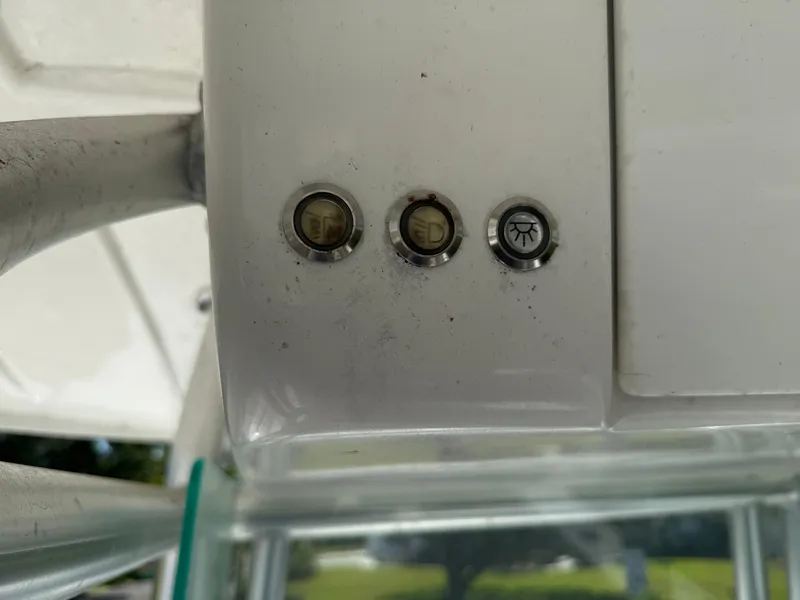 Slide: The Image of Control panel on a 2020 Cape Horn 27 XS boat with three buttons. - 48