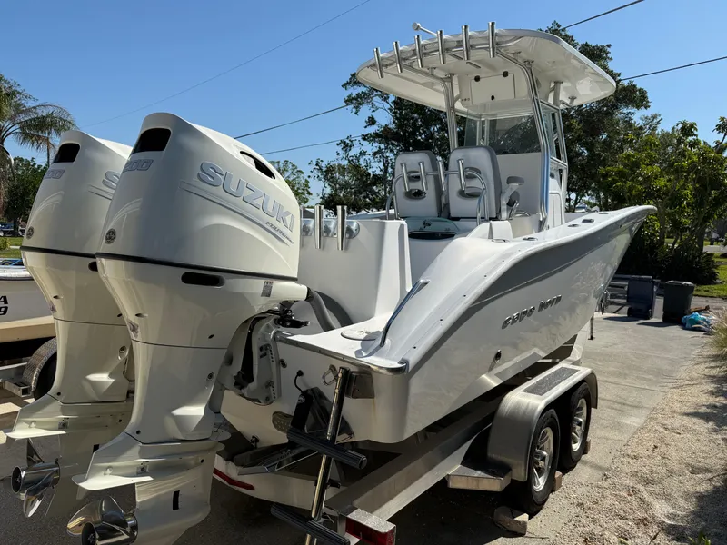 Slide: The Image of 2020 Cape Horn 27 XS boat with dual Suzuki engines on a trailer. - 7