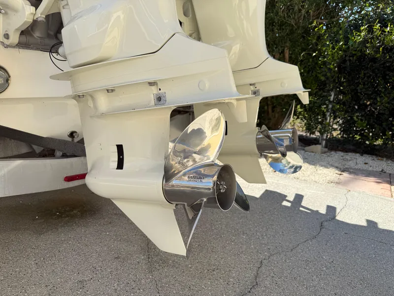 Slide: The Image of 2020 Cape Horn 27 XS boat with dual outboard motors and stainless steel propellers. - 12