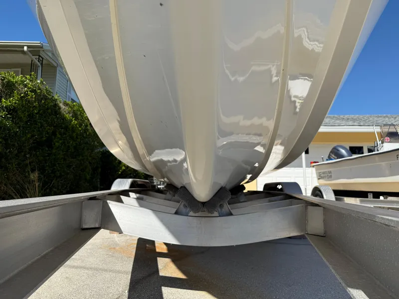 Slide: The Image of 2020 Cape Horn 27 XS boat hull on trailer, viewed from below. - 2