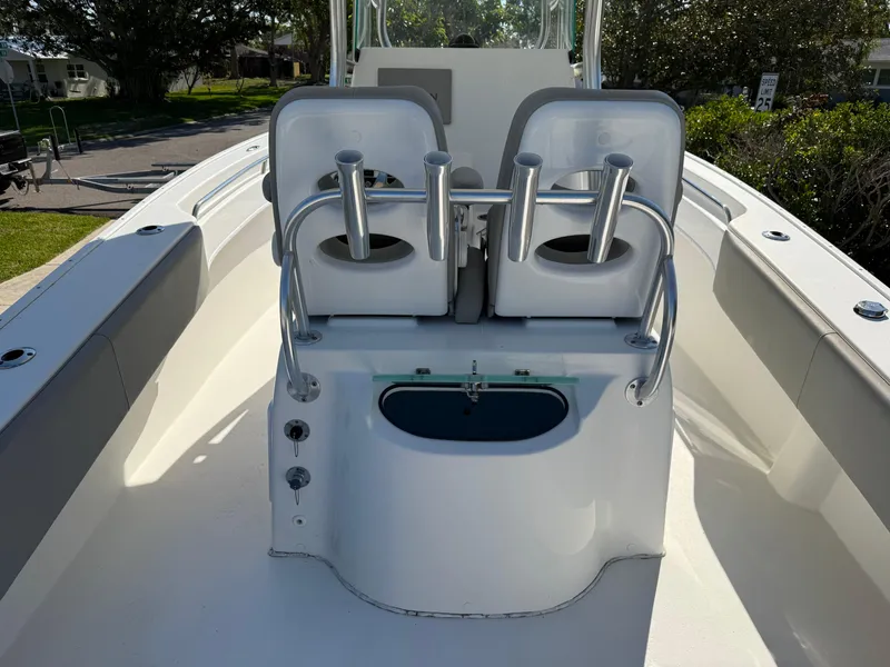 Slide: The Image of 2020 Cape Horn 27 XS boat interior with dual seats and rod holders. - 21