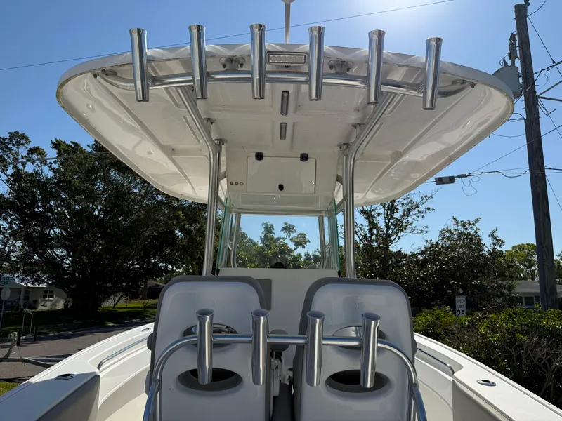 Slide: The Image of 2020 Cape Horn 27 XS boat with T-top and rod holders, viewed from the rear. - 23