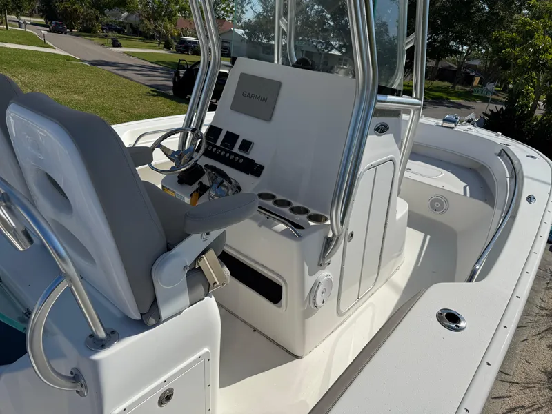 Slide: The Image of 2020 Cape Horn 27 XS boat interior with steering console and seating. - 26