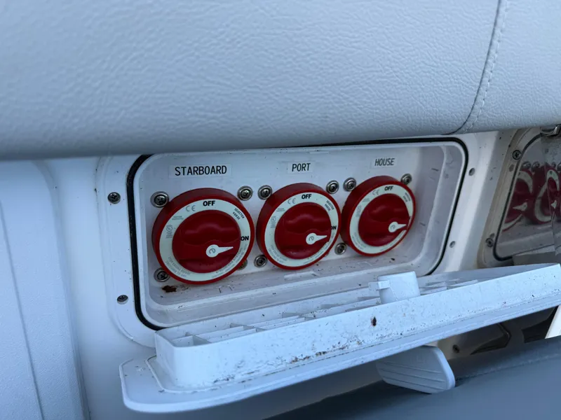 Slide: The Image of Battery switches on a 2020 Cape Horn 27 XS boat, labeled starboard, port, and house. - 34
