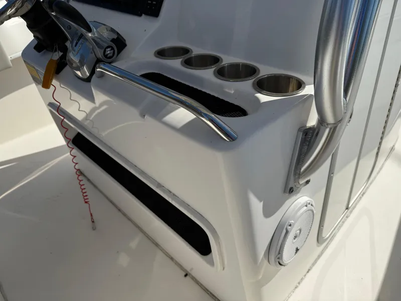 Slide: The Image of 2020 Cape Horn 27 XS boat console with cup holders and steering wheel. - 42