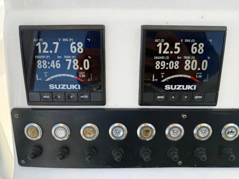 Slide: The Image of Digital displays on a 2020 Cape Horn 27 XS boat dashboard showing engine data. - 44