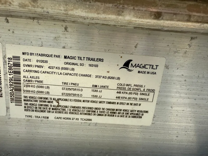 Slide: The Image of Label on Magic Tilt trailer, detailing specifications and capacities for Cape Horn 27 XS, 2020 model. - 9