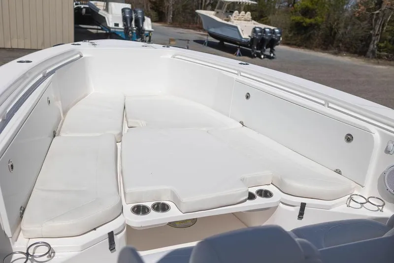 Slide: The Image of 2015 Everglades 355 Center Console boat with spacious seating and cup holders. - 12