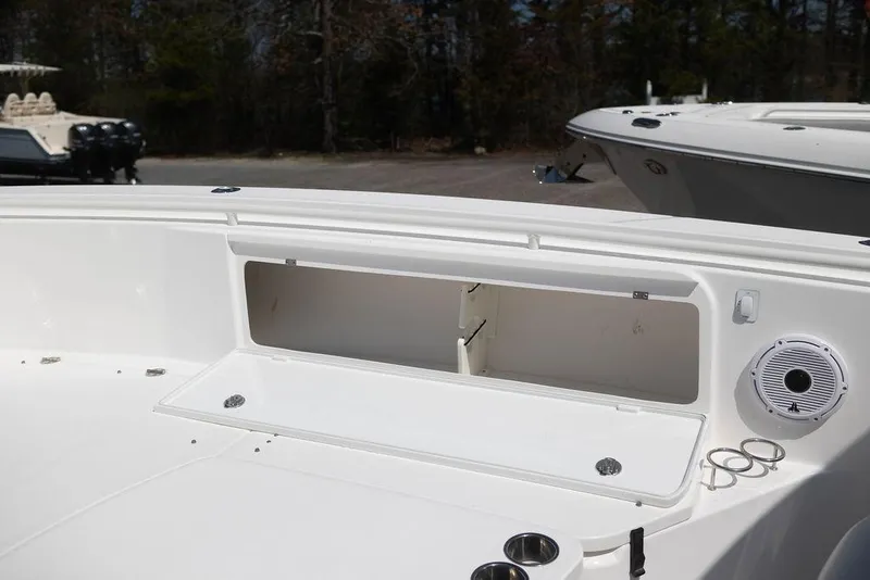 Slide: The Image of 2015 Everglades 355 Center Console boat with open storage compartment and speaker. - 20