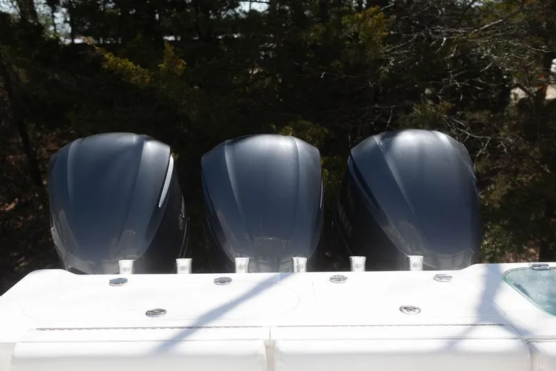Slide: The Image of Triple outboard engines on a 2015 Everglades 355 Center Console boat. - 21