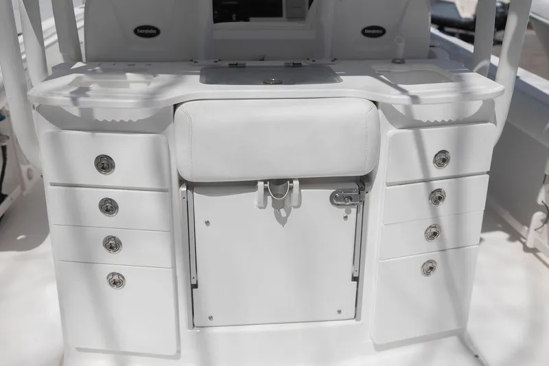 Slide: The Image of 2015 Everglades 355 Center Console boat interior with storage compartments and seating. - 22